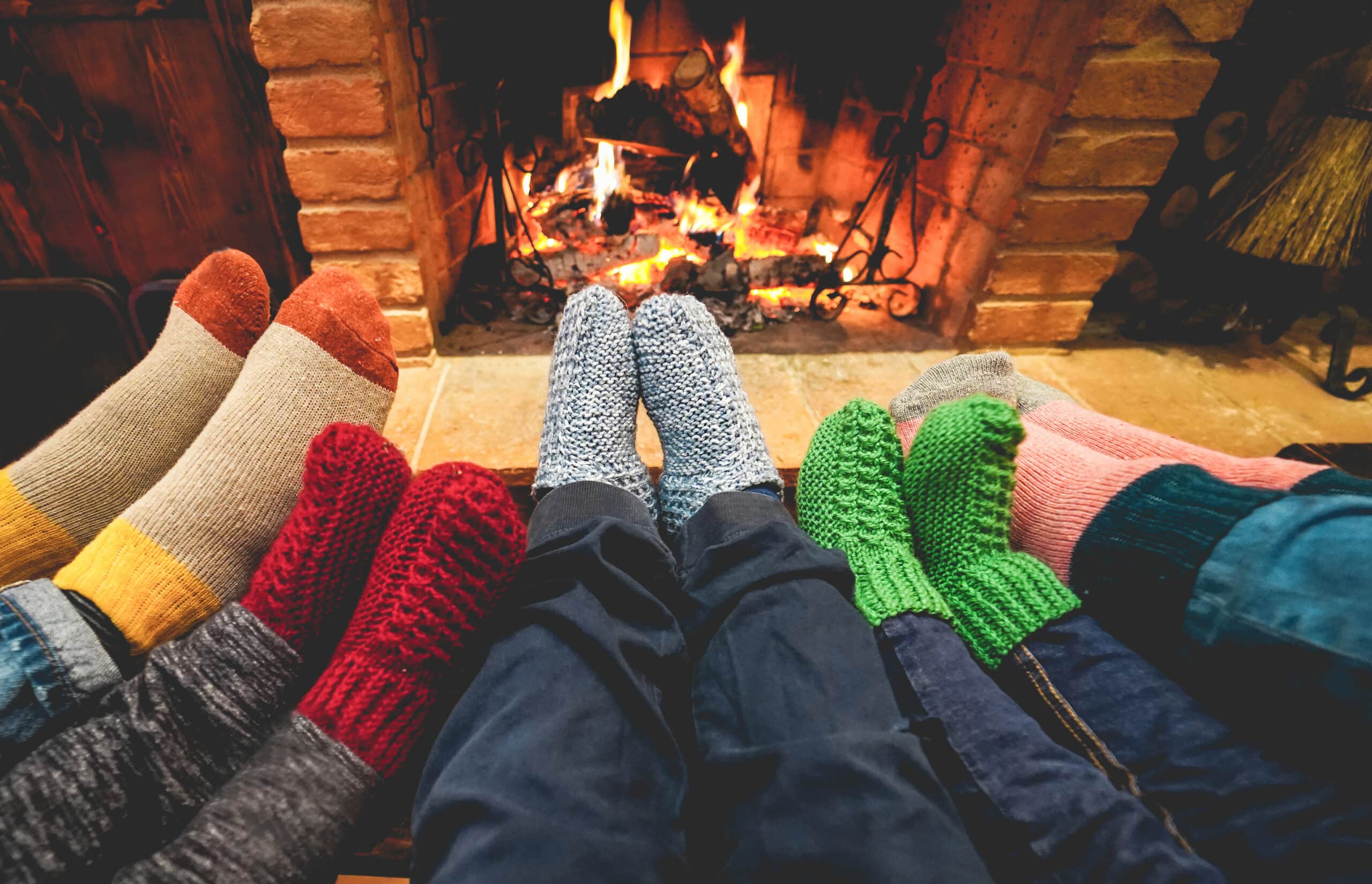 cozy family in front of fireplace hearth