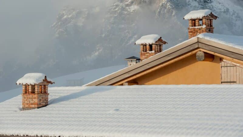 chimney caps covered with snow